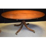 A George III design mahogany breakfast table, elliptical tilting top,