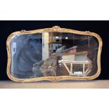 A Regency style rounded rectangular wall mirror, bevelled plate,