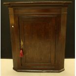 A George III oak corner cupboard c.
