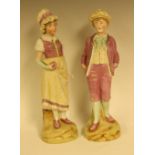 A pair of Victorian biscuit figures, as a young boy and girl, approx 31.