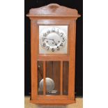 A 20th century oak cased wall clock, silvered dial, Roman numerals,
