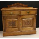 An Arts and Crafts period oak sideboard, c.