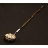 An unmarked white metal toddy ladle, possibly silver,