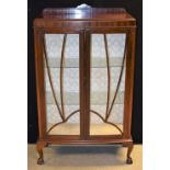 An early 20th century mahogany display cabinet, ball and claw feet, c.