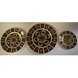 A graduated set of three Royal Crown Derby 1128 pattern plates,