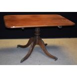 A George III mahogany breakfast table, of small proportions, rounded rectangular tilting top,