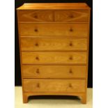 A mid-20th century hardwood chest of two short and five long drawers,