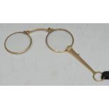 A pair of late 19th/early 20th century lady's gold-plate lorgnettes, of typical form,