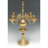 A William & Mary style brass five-light table centre candelabrum, scroll branches, waisted sconces,