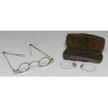 A pair of George III silver spectacles, oval lenses and arched bridge,