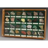 Geology - an arrangement of geological stone and mineral samples, each labelled,