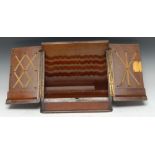 A Victorian walnut slope front stationery box, hinged twin-covers enclosing shaped divisions,