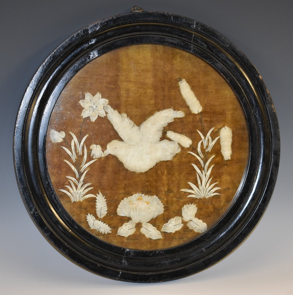 A 19th century cut-shell picture, possibly Indian, depicting a bird in flight above lotus,