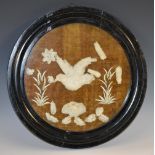 A 19th century cut-shell picture, possibly Indian, depicting a bird in flight above lotus,