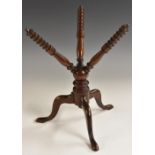 A 19th century mahogany tripod cat, the plate stand with turned supports, cabriole legs, pad feet,