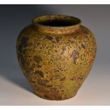 A Mediterranean/Roman ovoid terracotta vase, matte-mottled surface,