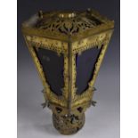 A Moorish brass pentagonal lantern, pierced with flowers, leafy scrolls, and roundels,