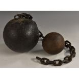 A 19th century cast iron ball and chain,