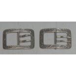 A pair of Victorian silver shoe buckles, engraved with scrolling foliage, 4cm wide,