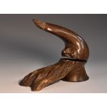 An unusual Black Forest table top lever-action nut cracker, carved as a bearded gnome,