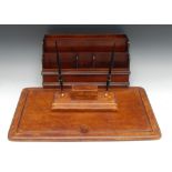 A tooled leather desk suite, comprising a pen stand with stamp box and and blotter,