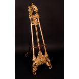 A Rococo gilt softwood picture easel, acanthus-capped leafy C-scroll cresting, laureate stratchers,