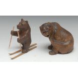 A Black Forest carving, of a bear skiing,
