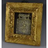 An Eastern Orthodox gilt metal icon, in relief with saints, 8cm x 7cm,