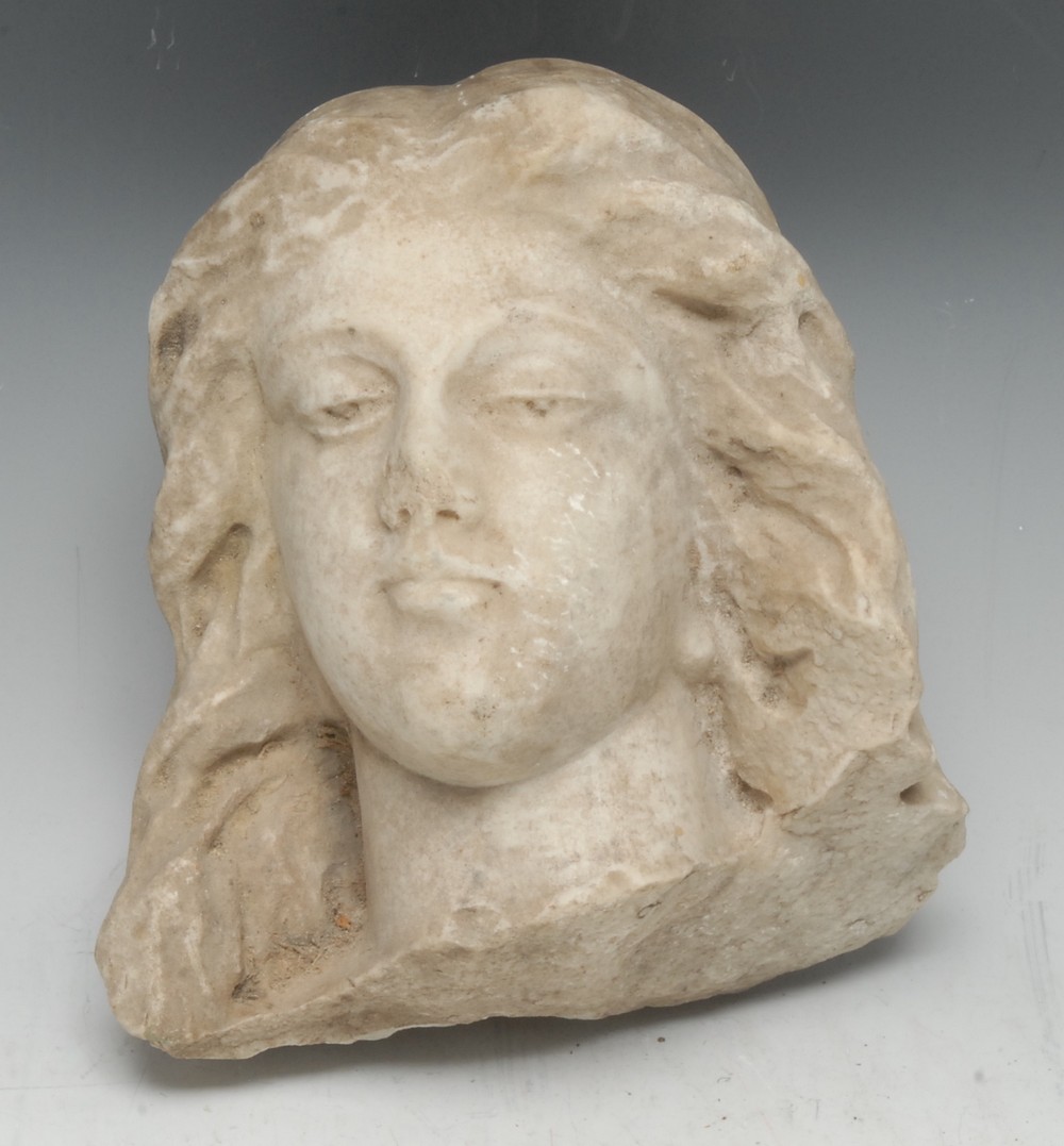 A Baroque marble sculptural fragment, carved as the head of a young woman with flowing hair,