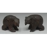 A pair of Black Forest carvings, of bears on all fours, glass eyes, 9cm high,