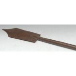 Tribal Art - a hardwood paddle club, the shaped head terminating in a point, disc pommel,