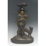 A Victory cast iron novelty figural door stop, cast a rural lumberjack and his hound by a tree,
