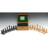 An early 20th century boxwood and ebony Staunton pattern weighted chess set, The Staunton Chessmen,