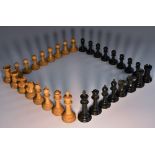 A boxwood and ebony Staunton pattern chess set, the Kings 9.