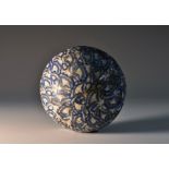 An unusual Staffordshire earthenware sphere, painted in underglaze blue, 7.