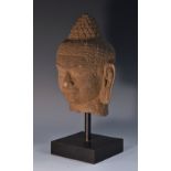 Antiquities - a Khmer stone statuary fragment, the head of Buddha, 22cm high,