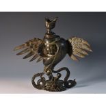 Chinese School (19th century), a dark patinated bronze, of Guanyin in the Heart of a Lotus,