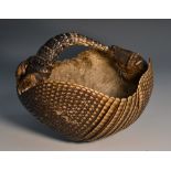 Natural History - an armadillo shell, fashioned as a basket,