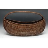 Tribal Art - a Native American wicker basket, of canoe shop, 71cm wide,