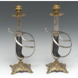 Militaria - a pair of 19th century gilt-brass and sword candlesticks,