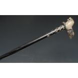 A Colonial ebony walking stick, associated horn handle carved as a recumbent lion,
