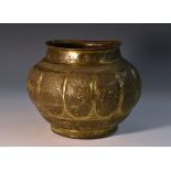 A Persian gilt sheet brass lobed ovoid lota, chased in the Islamic taste with Arabic script,