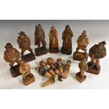 A collection of Black Forest figures, carved as musicians and characters from the street,