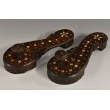 A pair of Ottoman Turkish nalin bathing clogs, inlaid with roundels and star motifs, 26cm long, c.