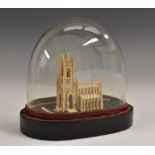 A 19th century matchwood model, of Brighton Church, glass dome with ebonised base,