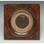 A 19th century brown patinated bronze portrait medallion, Napoleon as Emperor, after Andrieu,