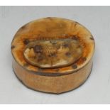 A 19th century folk art cattle horn circular snuff box, hinged cover,