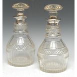 A pair of William IV cut glass club-shaped decanters,