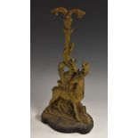 A 19th century brass and cast iron door stop, cast with a deer,