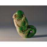 A Chinese two-tone jade amulet, of a Shou-Lao as a merman,